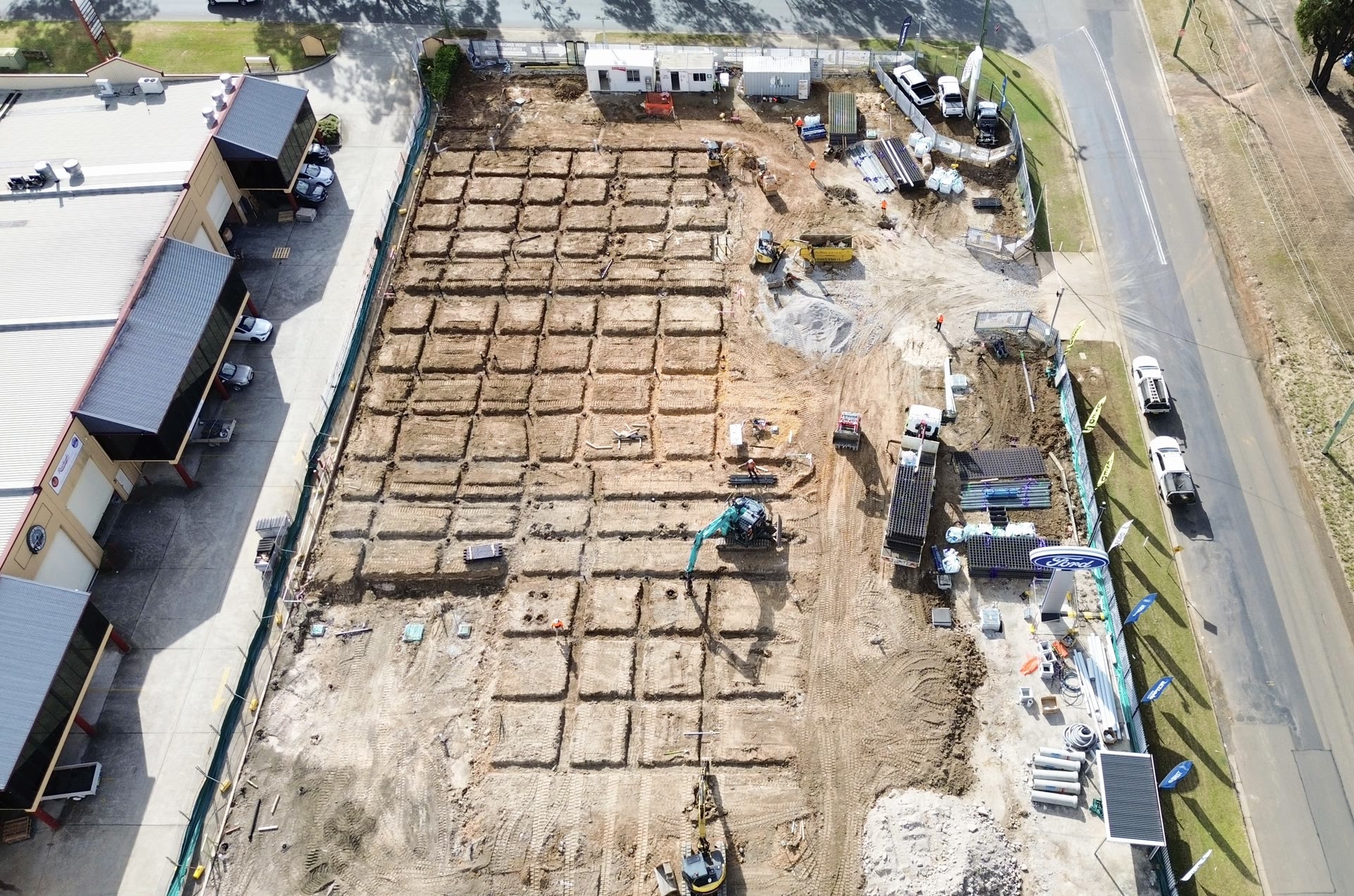 Steel screw piles supporting a structural beam connection