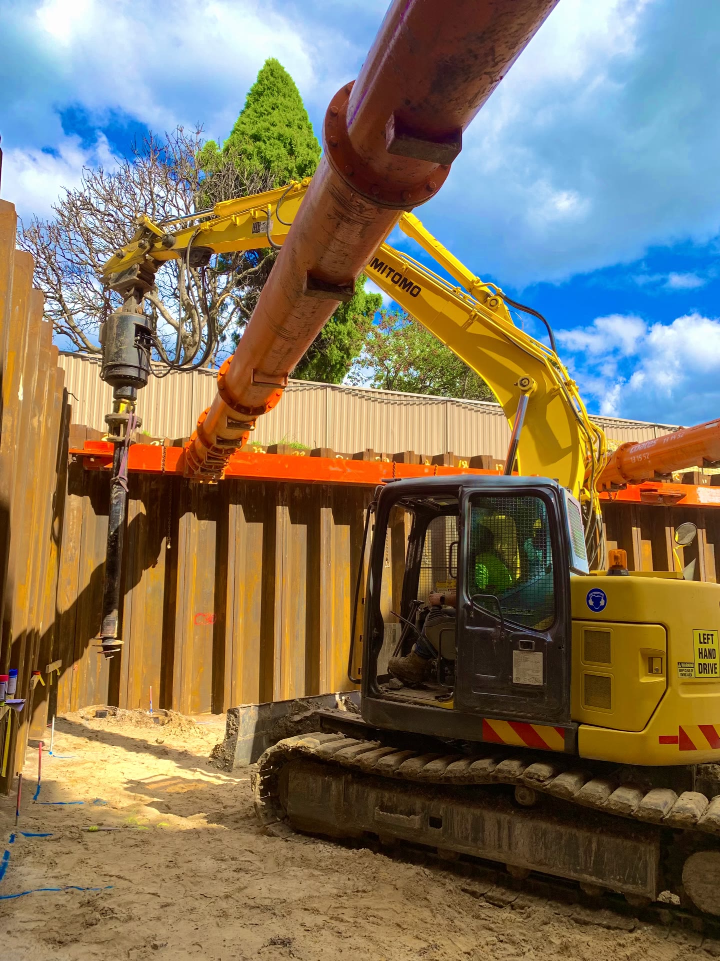 Hydraulic drive head engaging a Multiturn screw pile on site